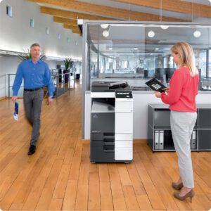 Konica Minolta photocopier in an office environment